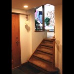 View from Library up the stairs to the sun-drenched Living Room