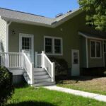 side of house with new door and outside stairs